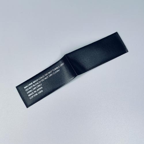 Distinctive Custom Black Satin Ribbon Labels with White Logos via Silk - Screen Printing